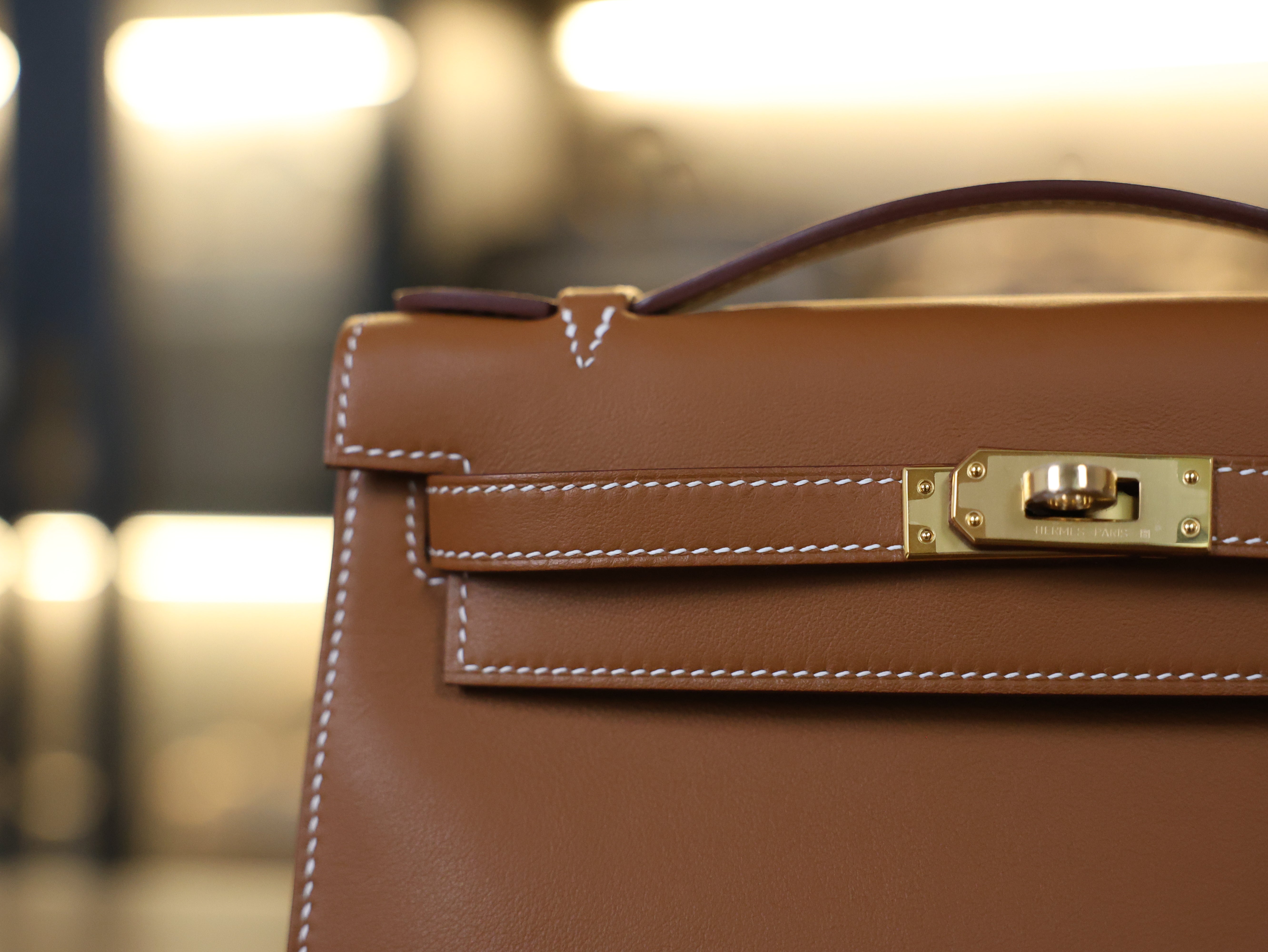 Kelly pochette swift gold GHW
