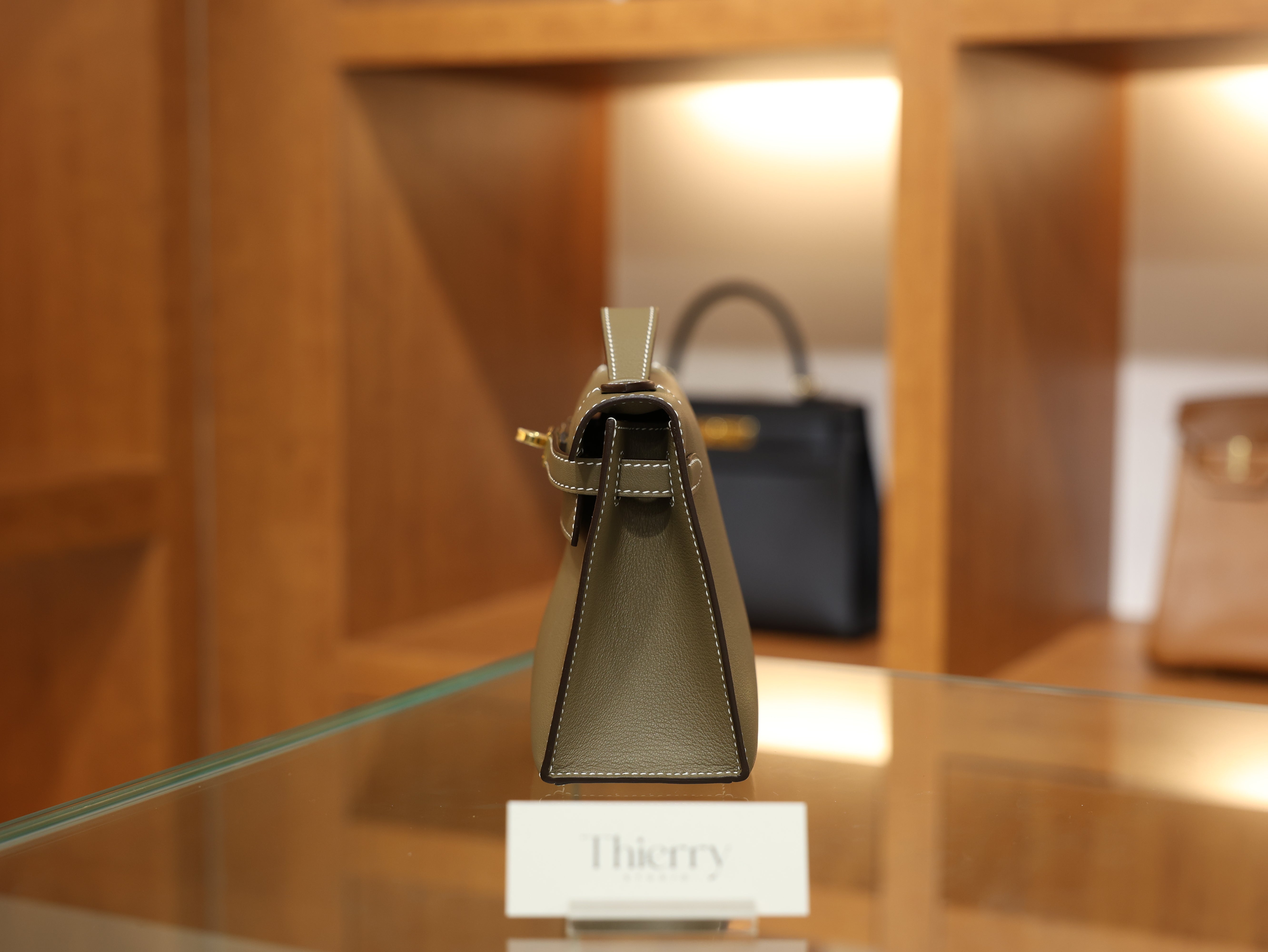 Kelly pochette swift etoupe GHW