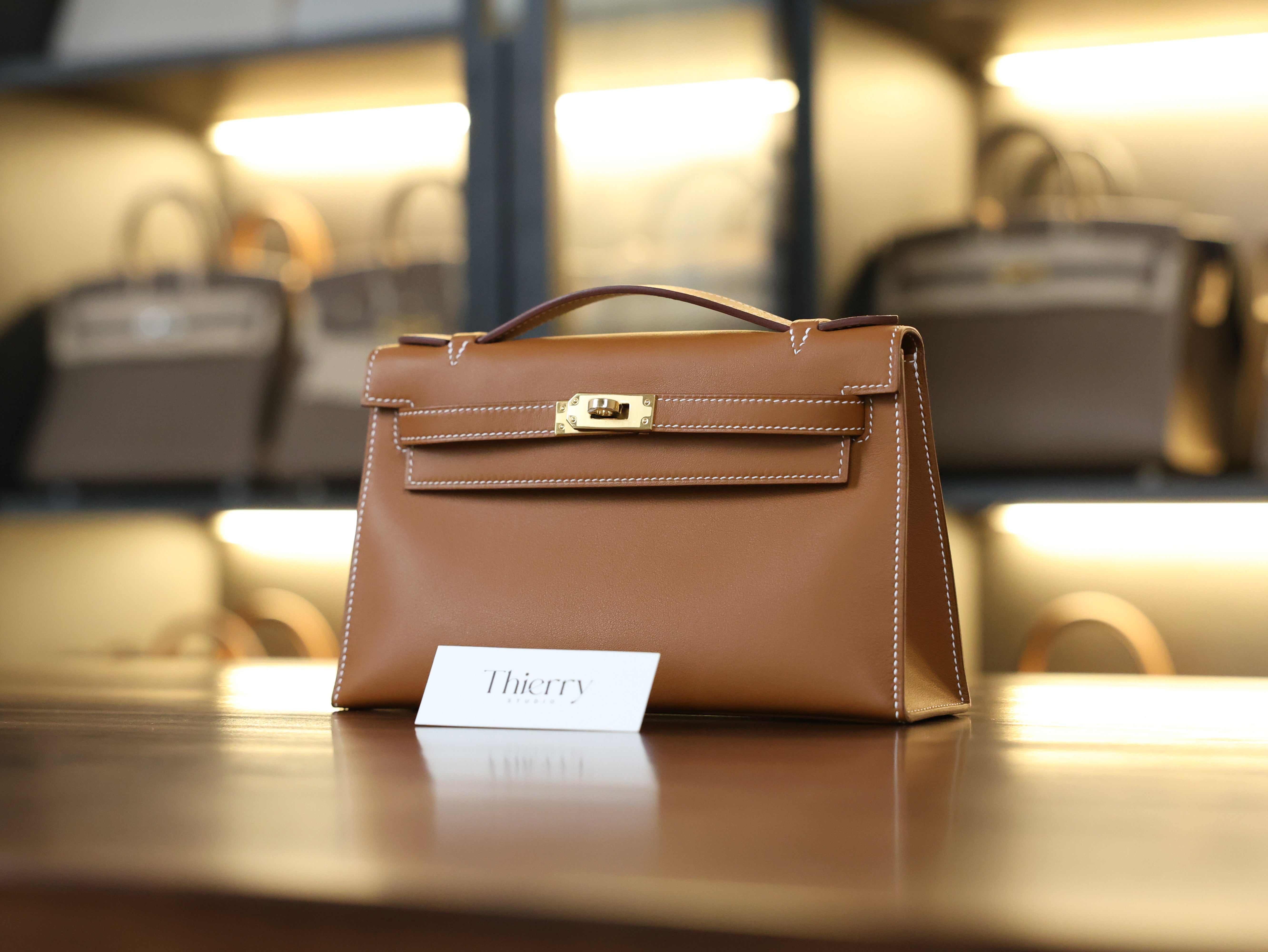 Kelly pochette swift gold GHW