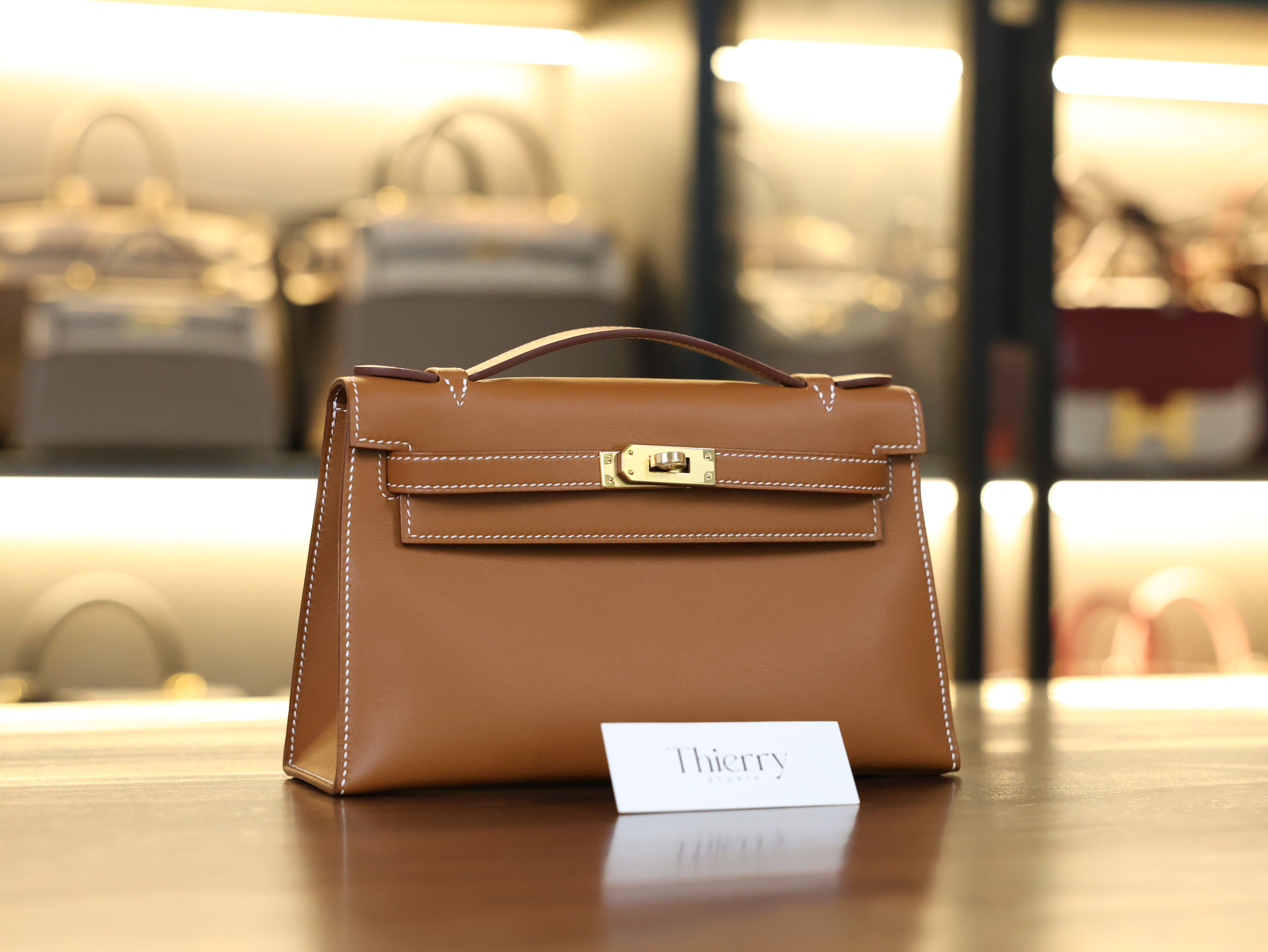 Kelly pochette swift gold GHW