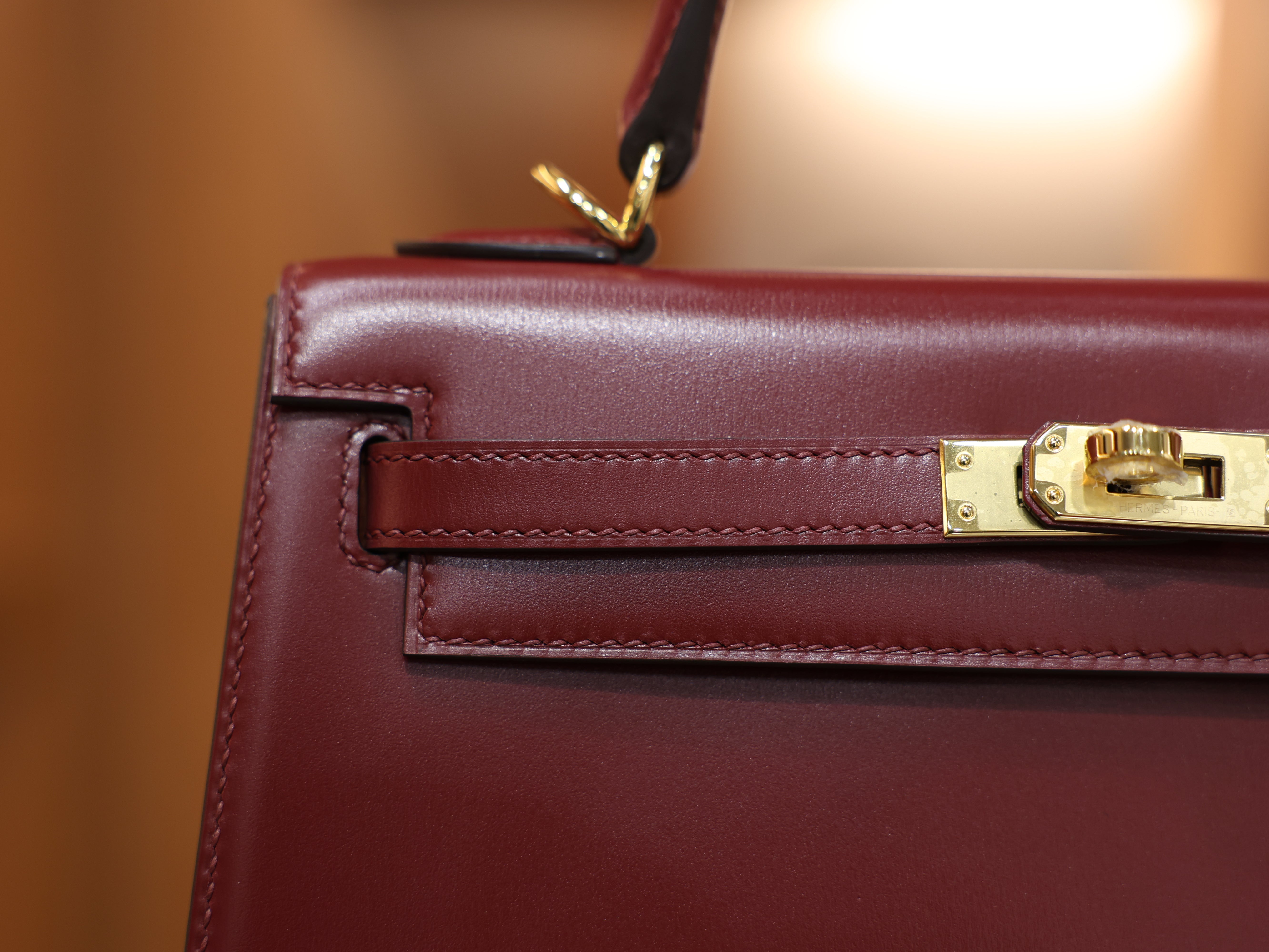 kelly 25 box sellier rouge H GHW