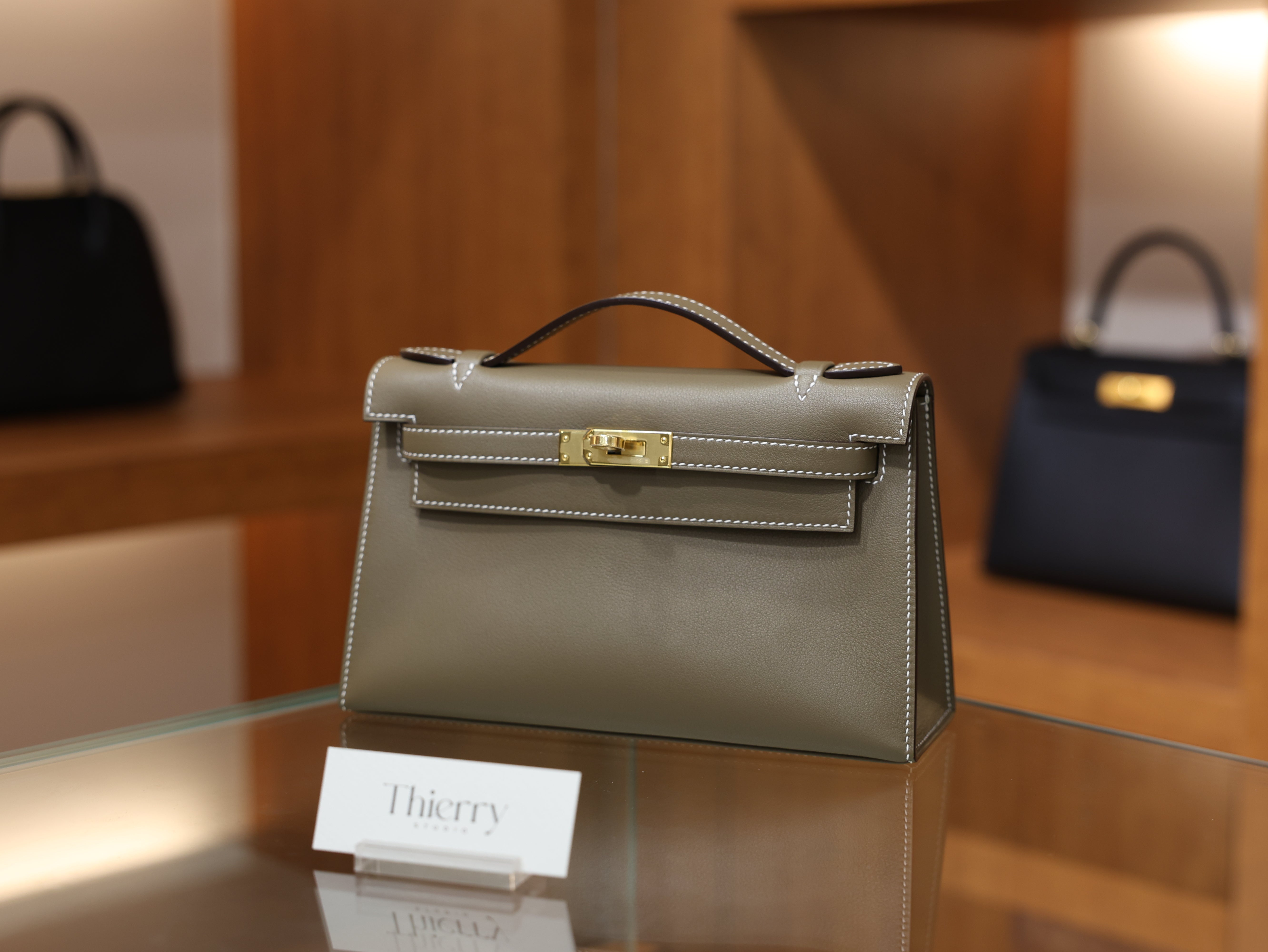Kelly pochette swift etoupe GHW