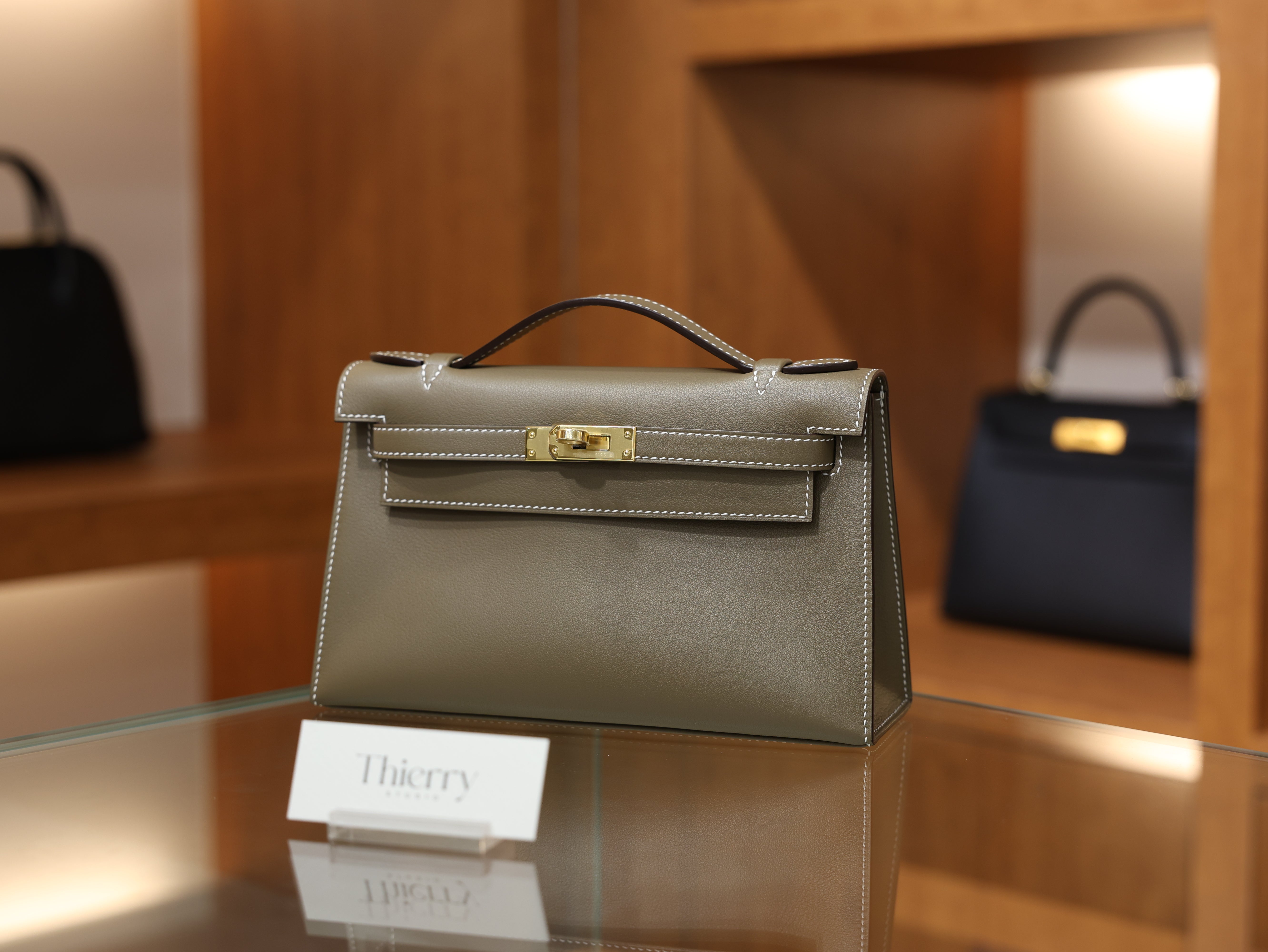 Kelly pochette swift etoupe GHW