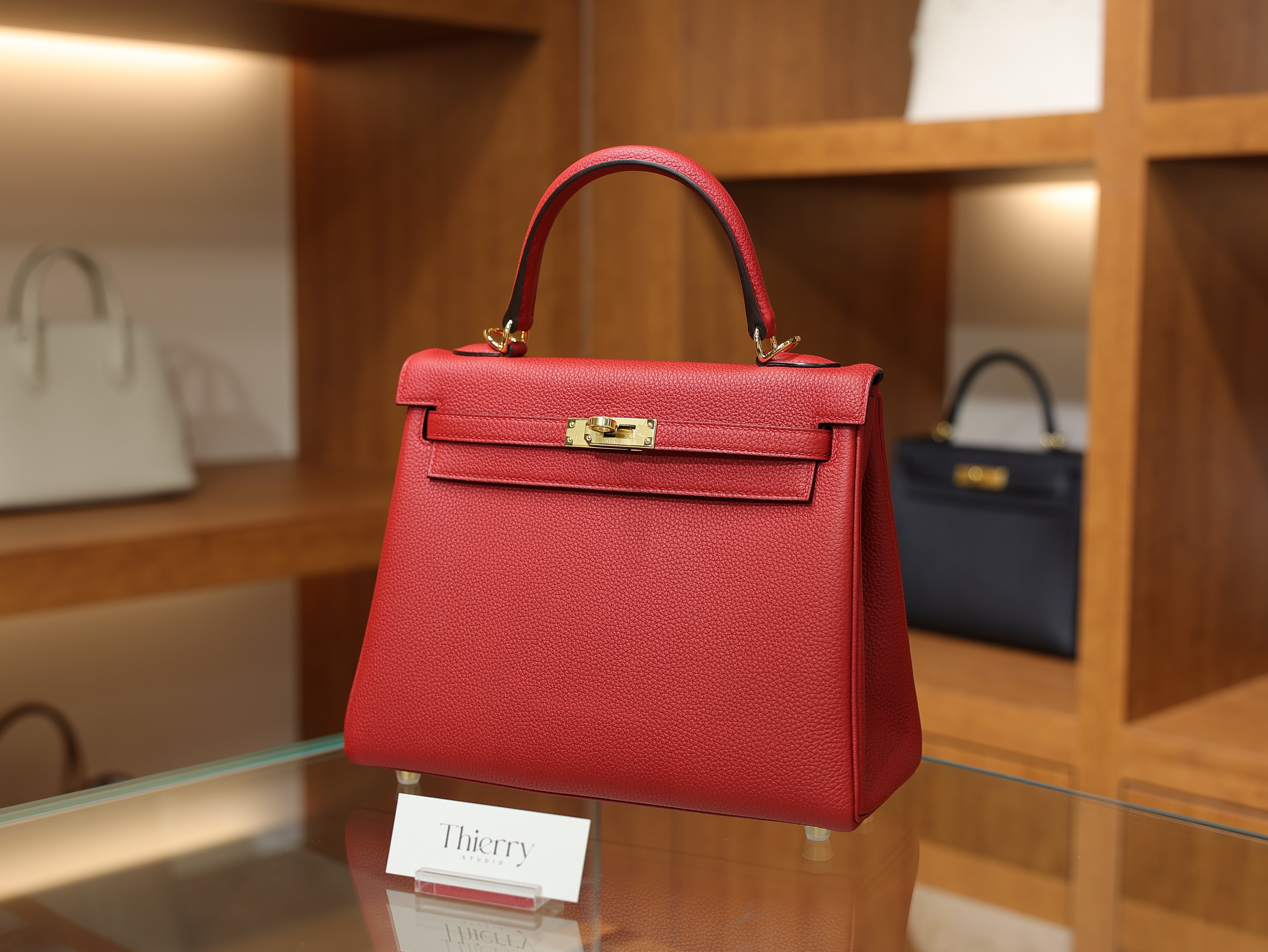 Kelly 25 togo rouge casaque GHW