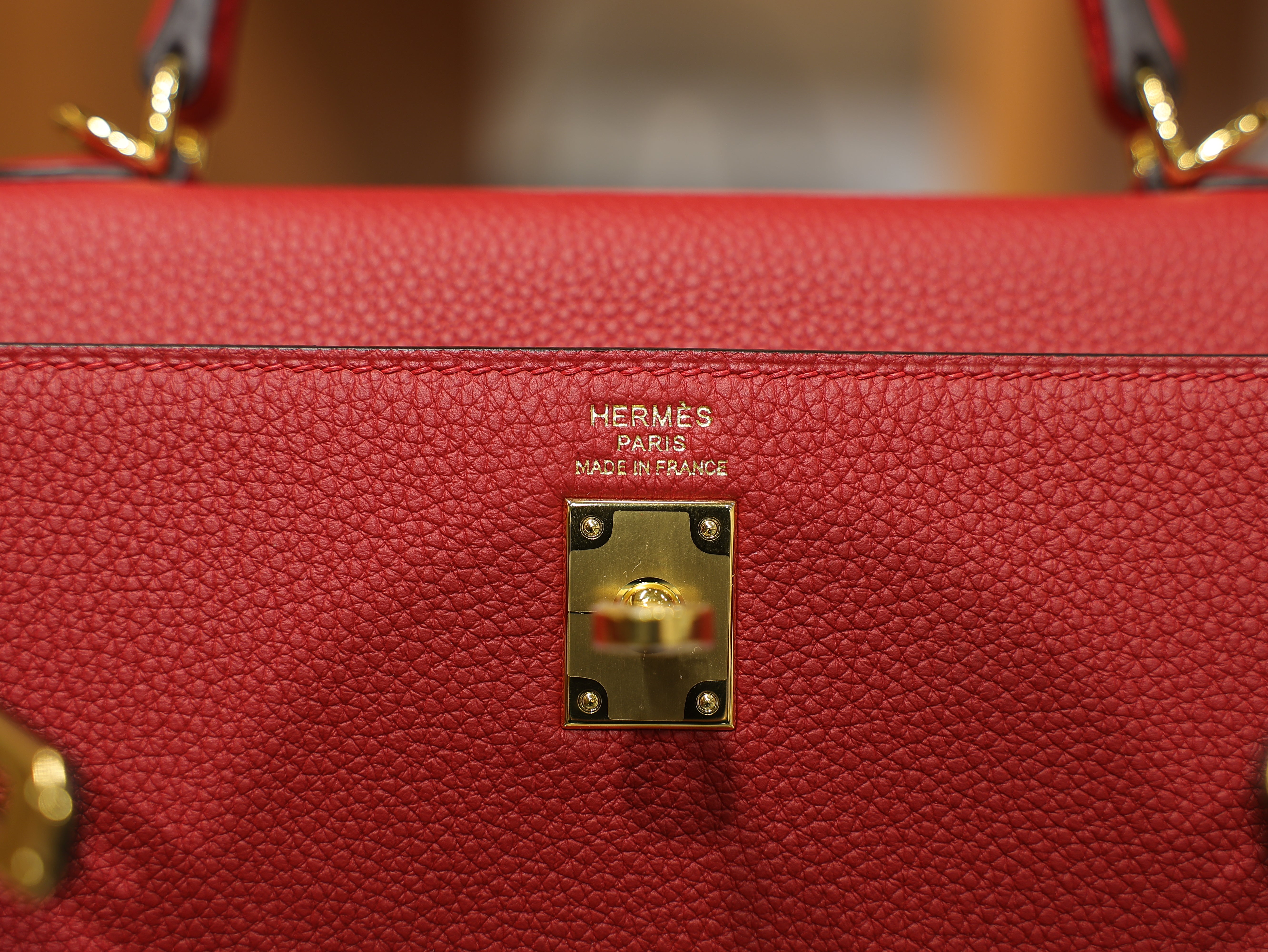Kelly 25 togo rouge casaque GHW
